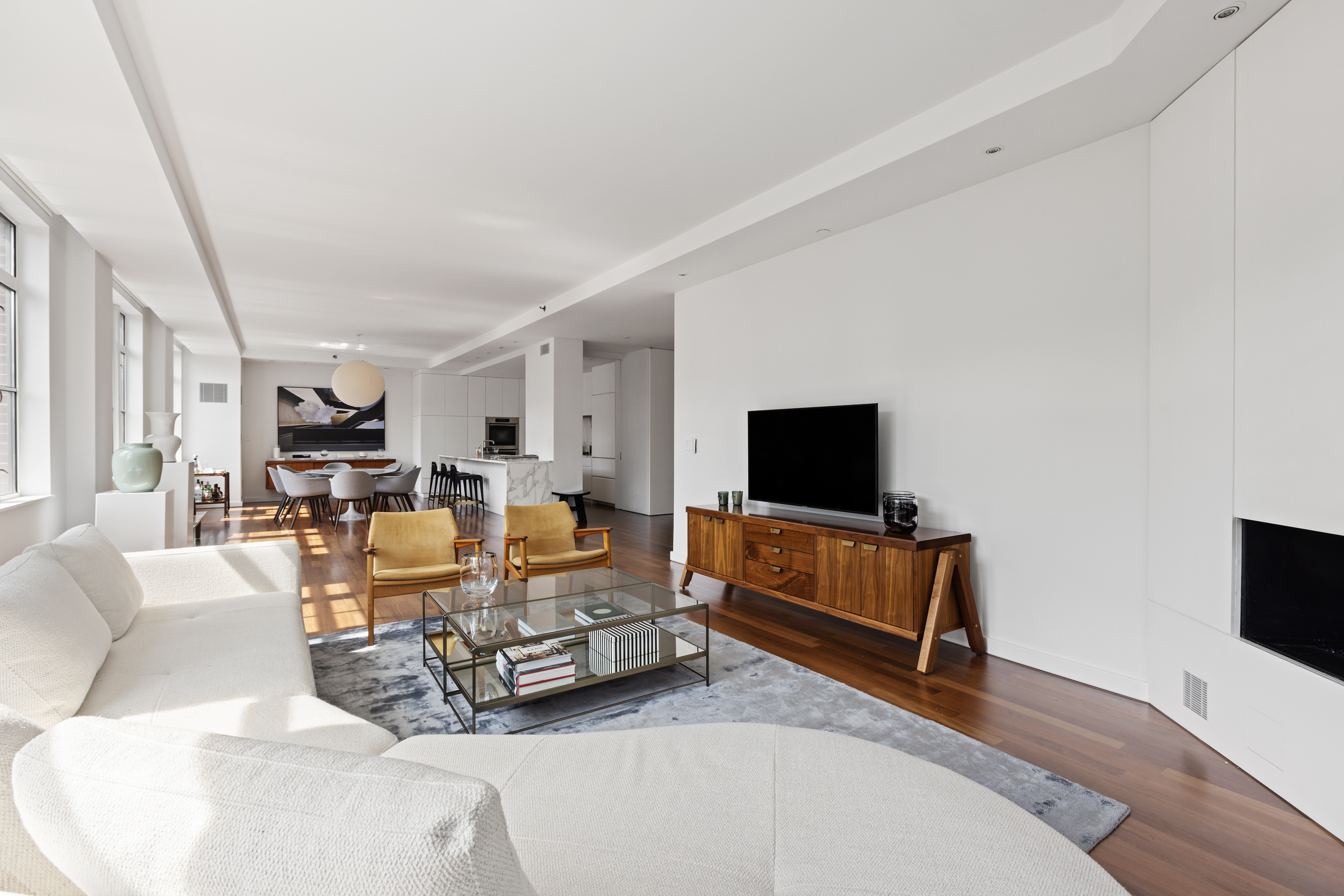 744 Greenwich Street, Unit 4 Manhattan, NY 10014 - Photo 3 of 34 a living room with furniture and a flat screen tv