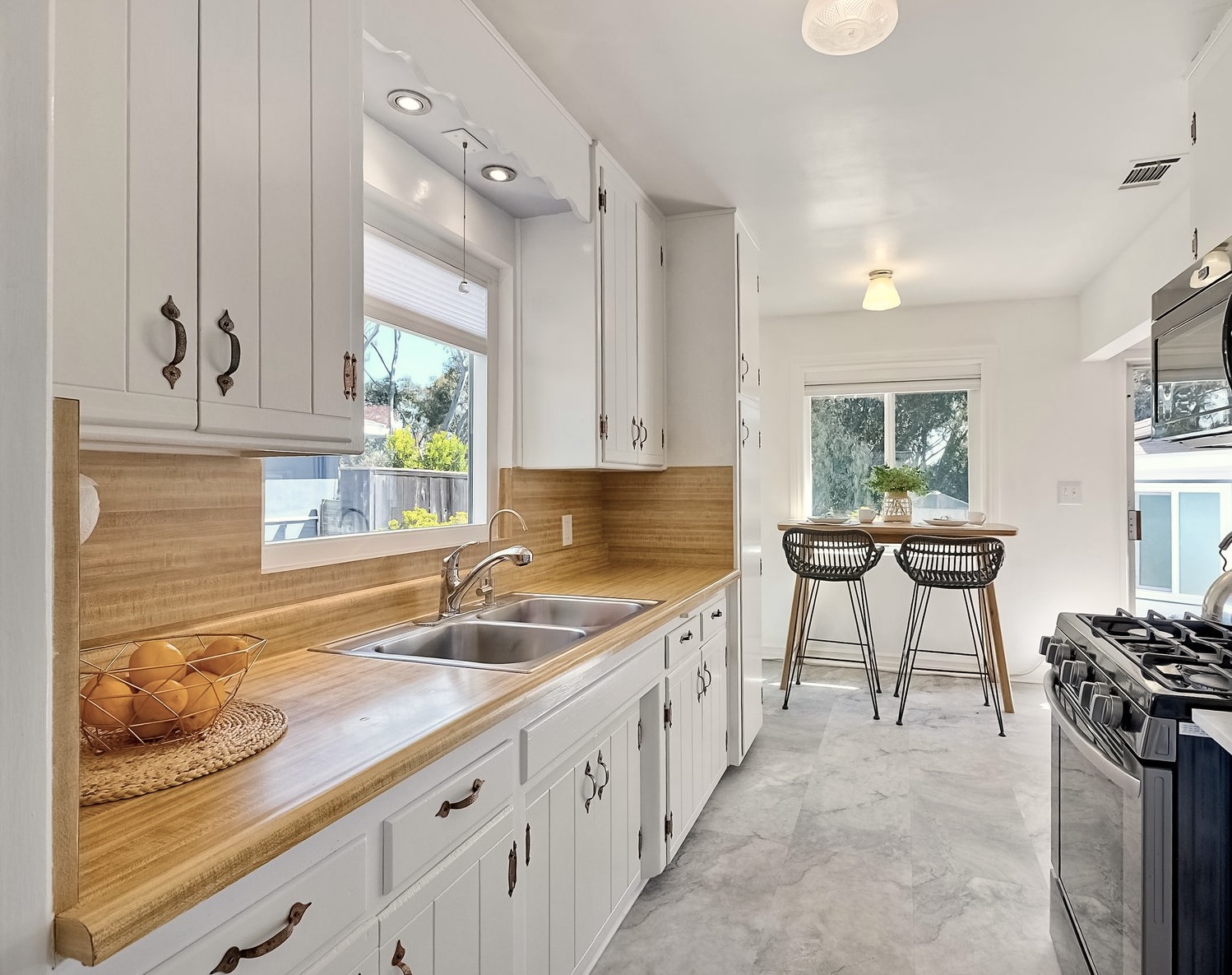 534 Hoover Street Oceanside, CA 92054 - Photo 12 of 31 a kitchen with a sink stove and cabinets