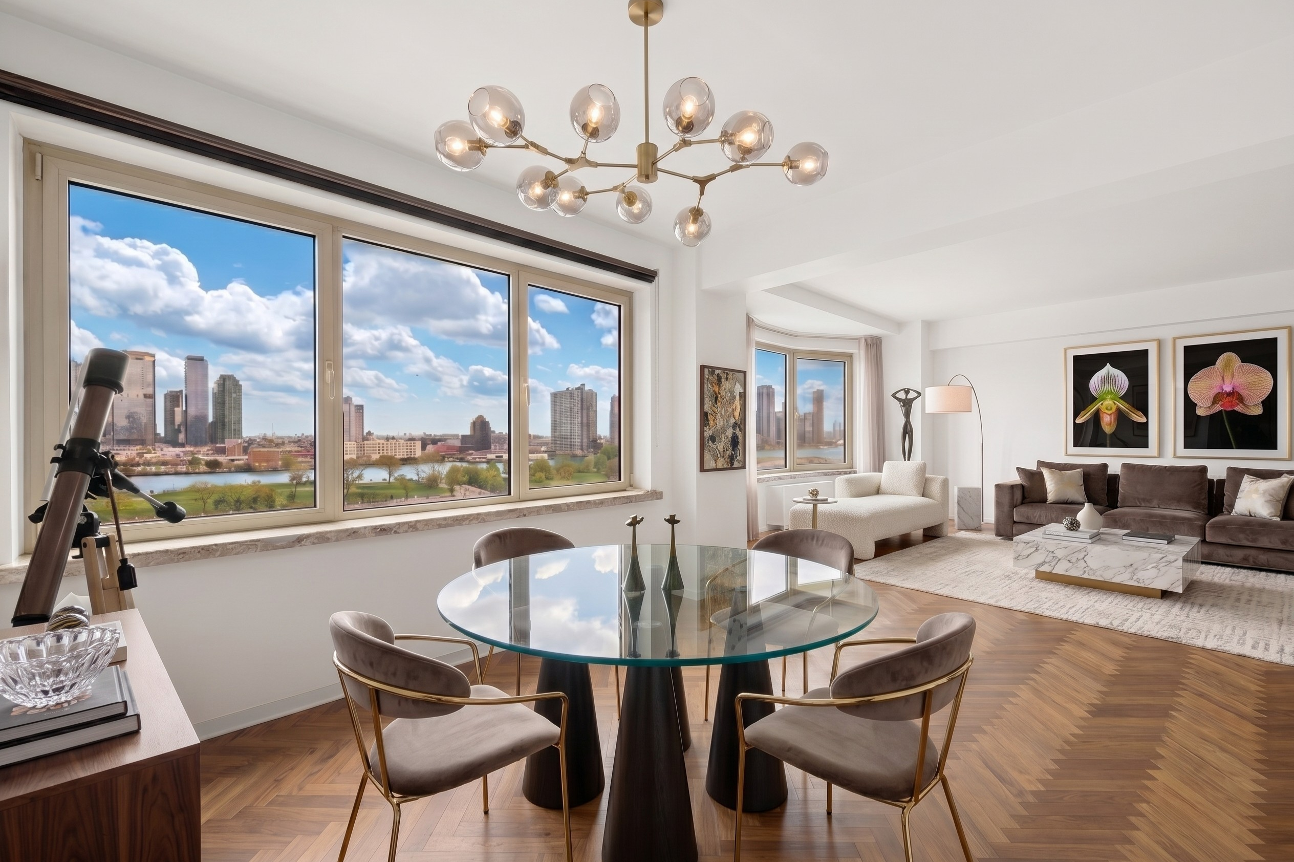 25 Sutton Place South, Unit 11M Manhattan, NY 10022 - Photo 2 of 10 a living room with furniture large window and wooden floor
