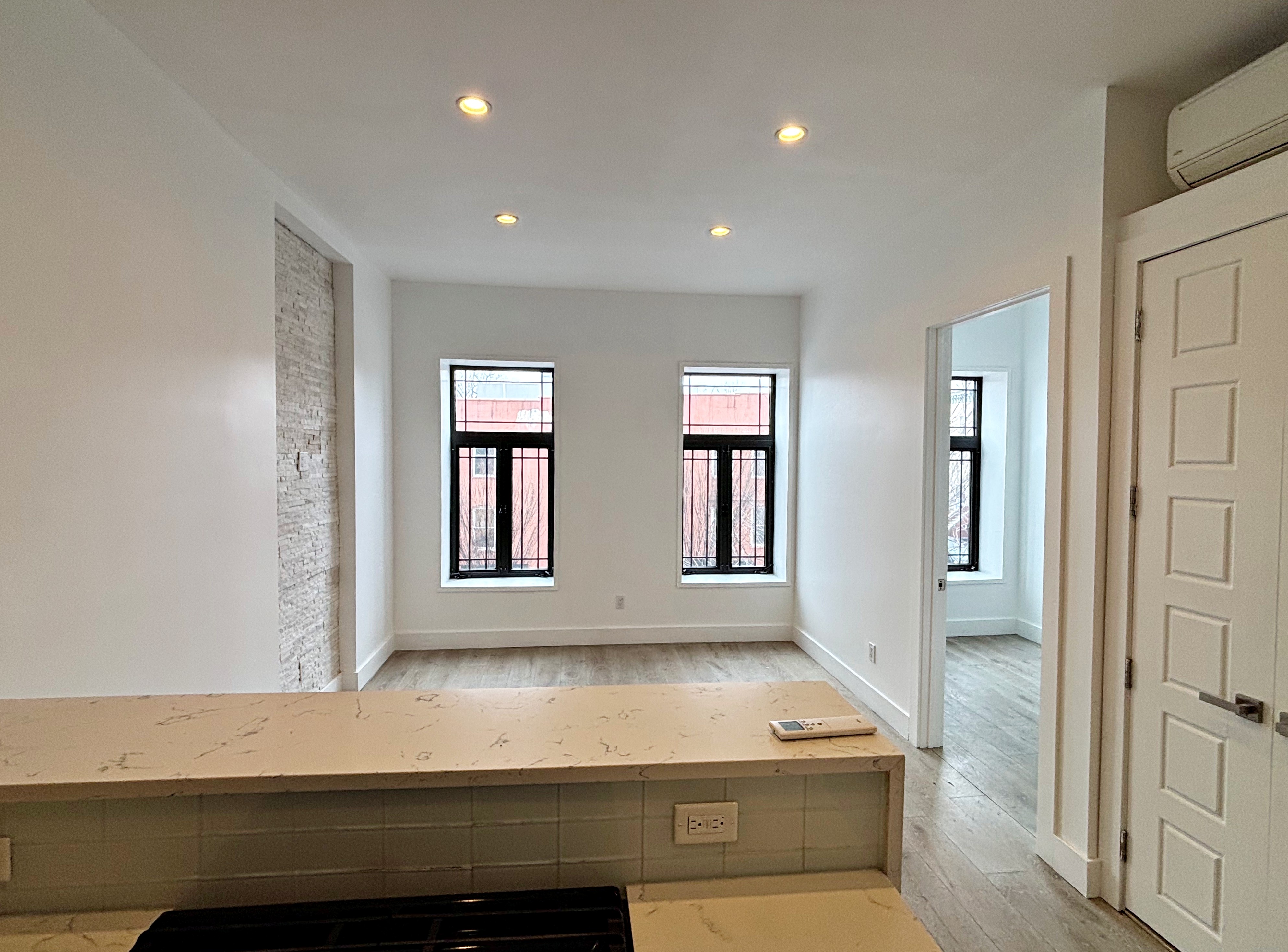 385 Nostrand Avenue, Unit Undisclosed Brooklyn, NY 11216 - Photo 16 of 27 a room with pool table and windows