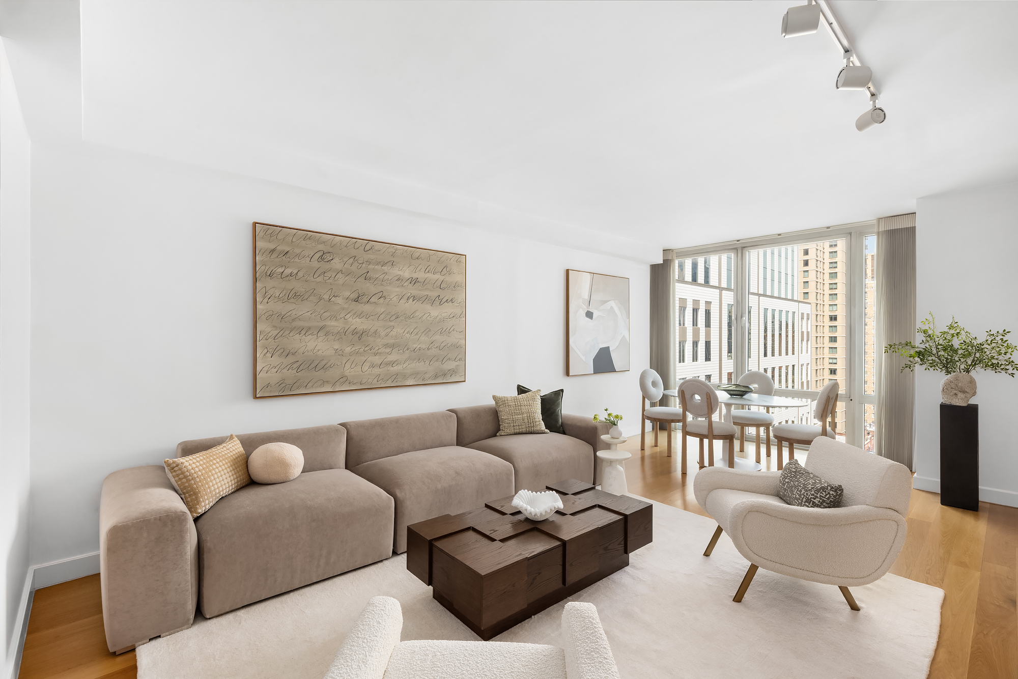408 East 79th Street, Unit 14B Manhattan, NY 10075 - Photo 2 of 18 a living room with furniture and a large window