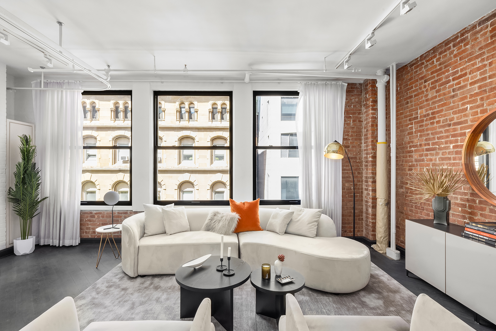 36 West 15th Street, Unit 4 Manhattan, NY 10011 - Photo 4 of 21 a living room with furniture and a large window