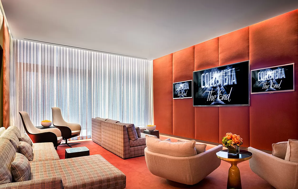 23 East 22nd Street, Unit 8A Manhattan, NY 10010 - Photo 21 of 25 a living room with furniture and a flat screen tv