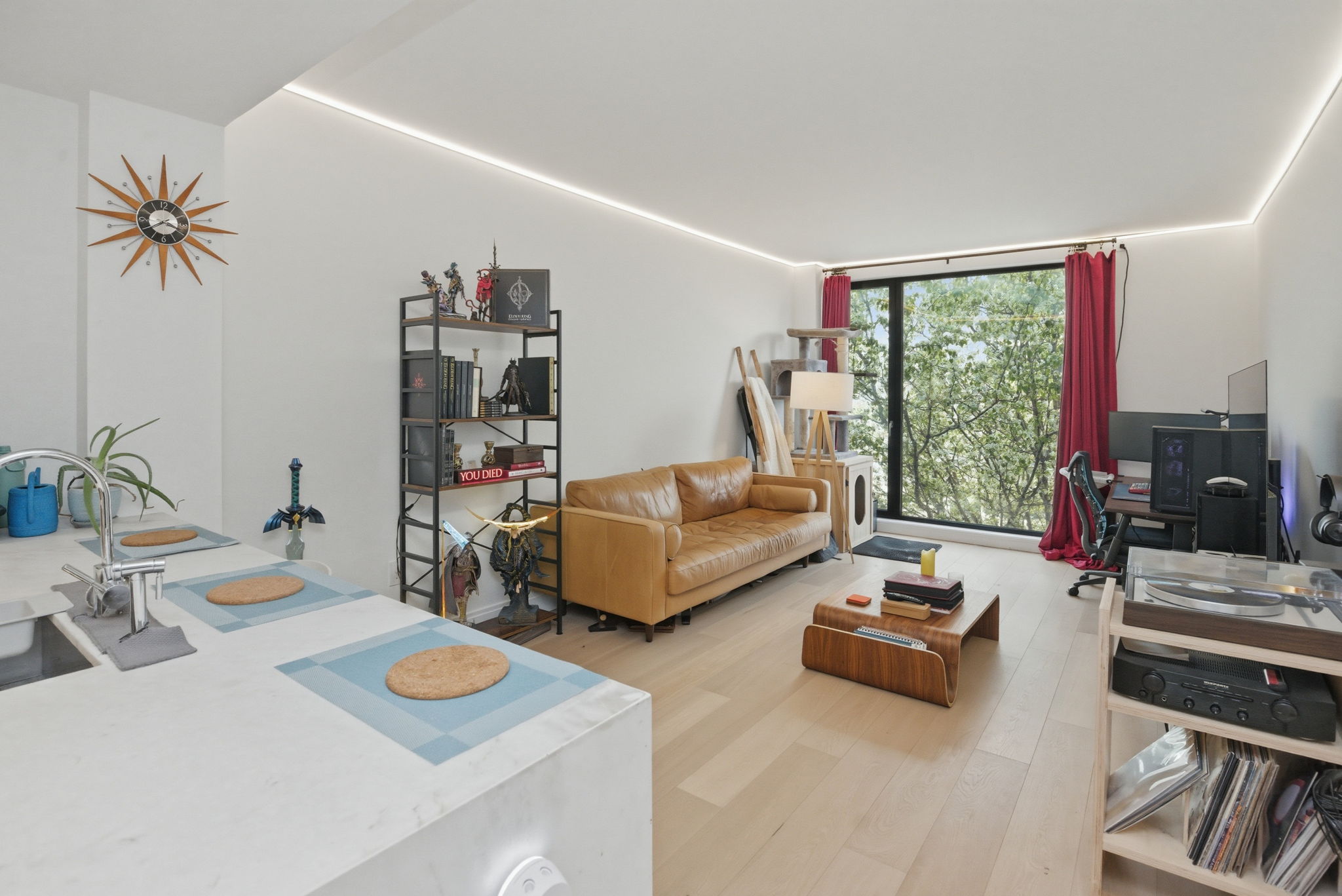 a living room with furniture and a large window