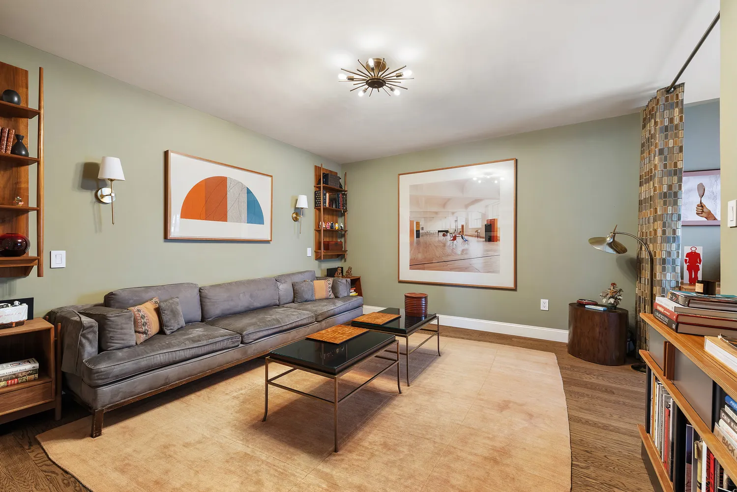 a living room with furniture a rug and a window
