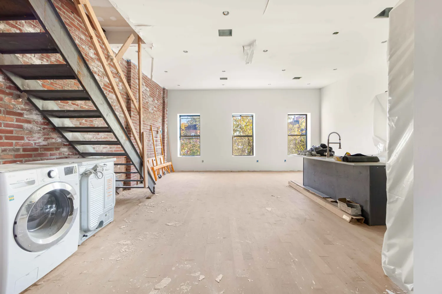 a view of a bedroom with furniture and staircase