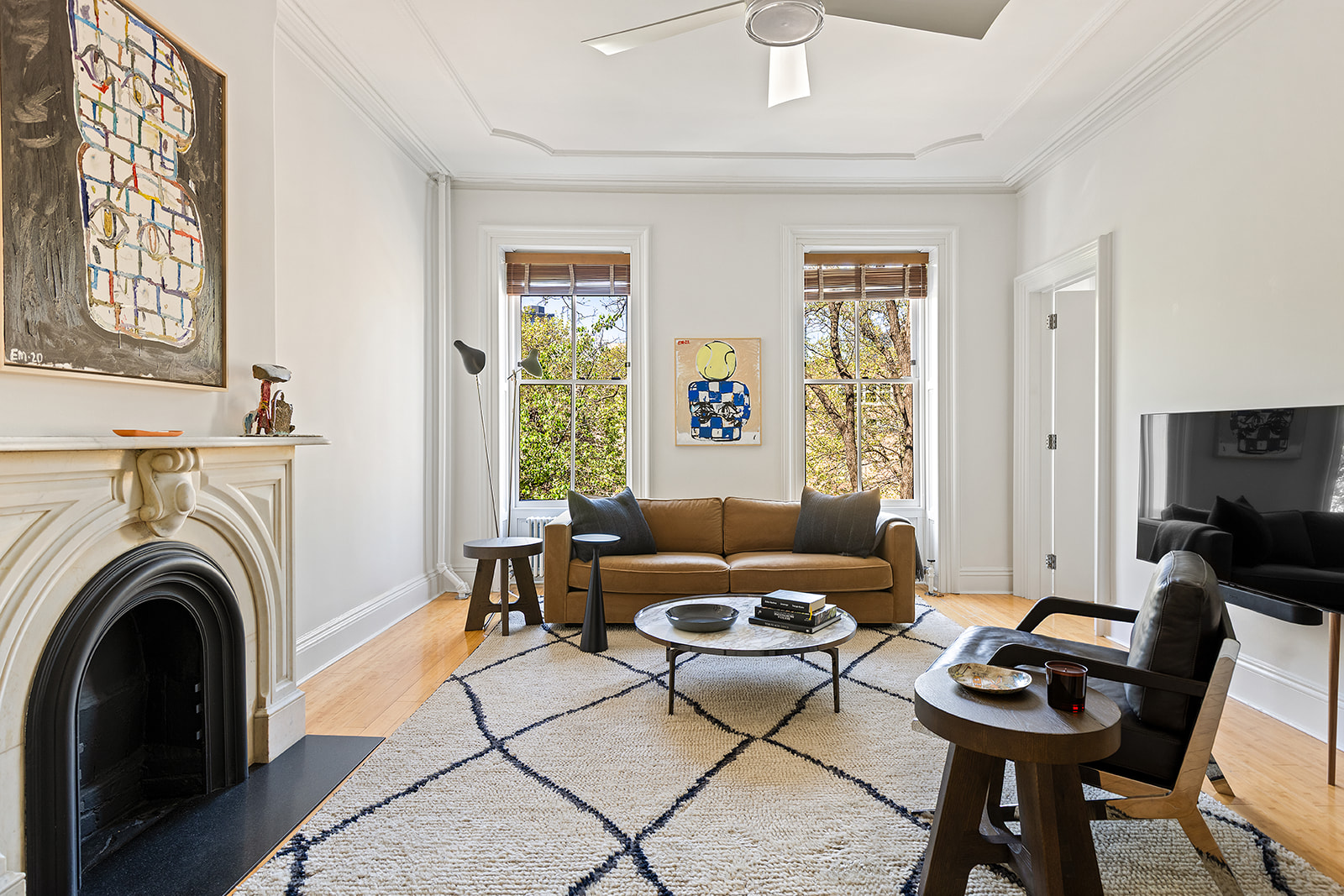 315 Adelphi Street Brooklyn, NY 11205 - Photo 21 of 31 a living room with furniture and a fireplace