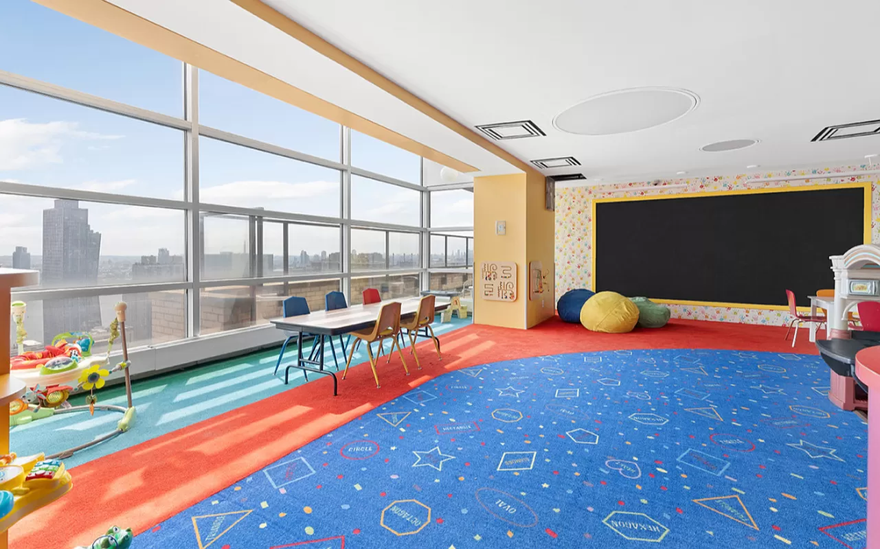 160 East 38th Street, Unit 26FG Manhattan, NY 10016 - Photo 16 of 23 a view of a play room with furniture and wooden floor