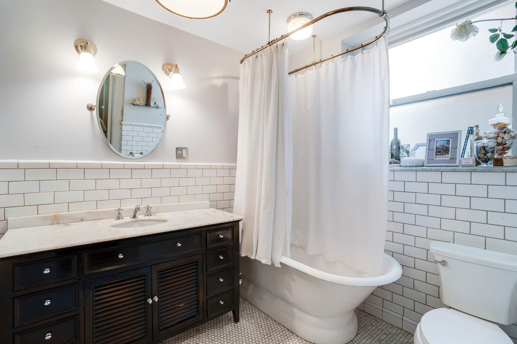 138 East 36th Street, Unit 3B Manhattan, NY 10016 - Photo 10 of 15 a bathroom with a toilet sink and mirror