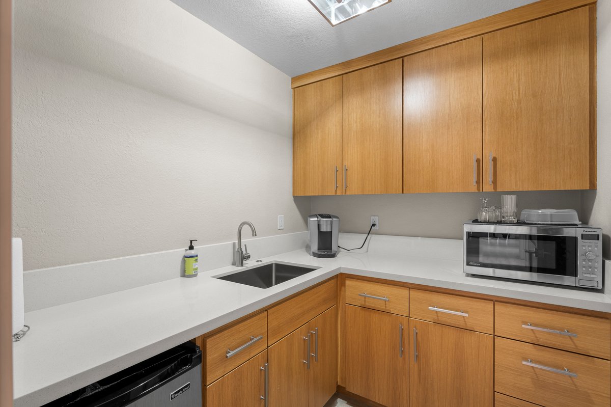 625 Highway 50 Zephyr Cove, NV 89448 - Photo 8 of 38 a kitchen with a sink and cabinets