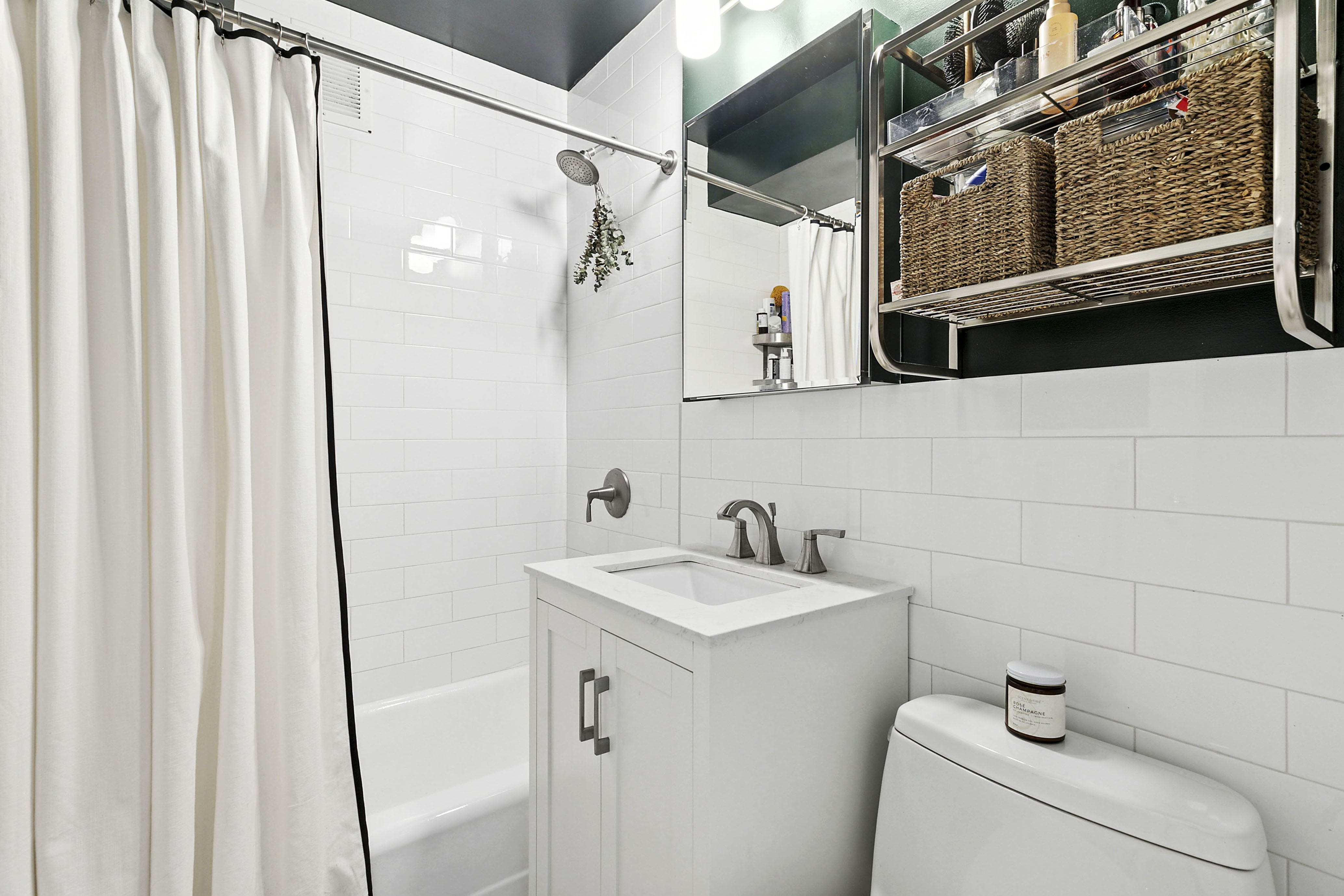 185 West Houston Street, Unit 4H Manhattan, NY 10014 - Photo 5 of 11 a bathroom with a sink and a mirror