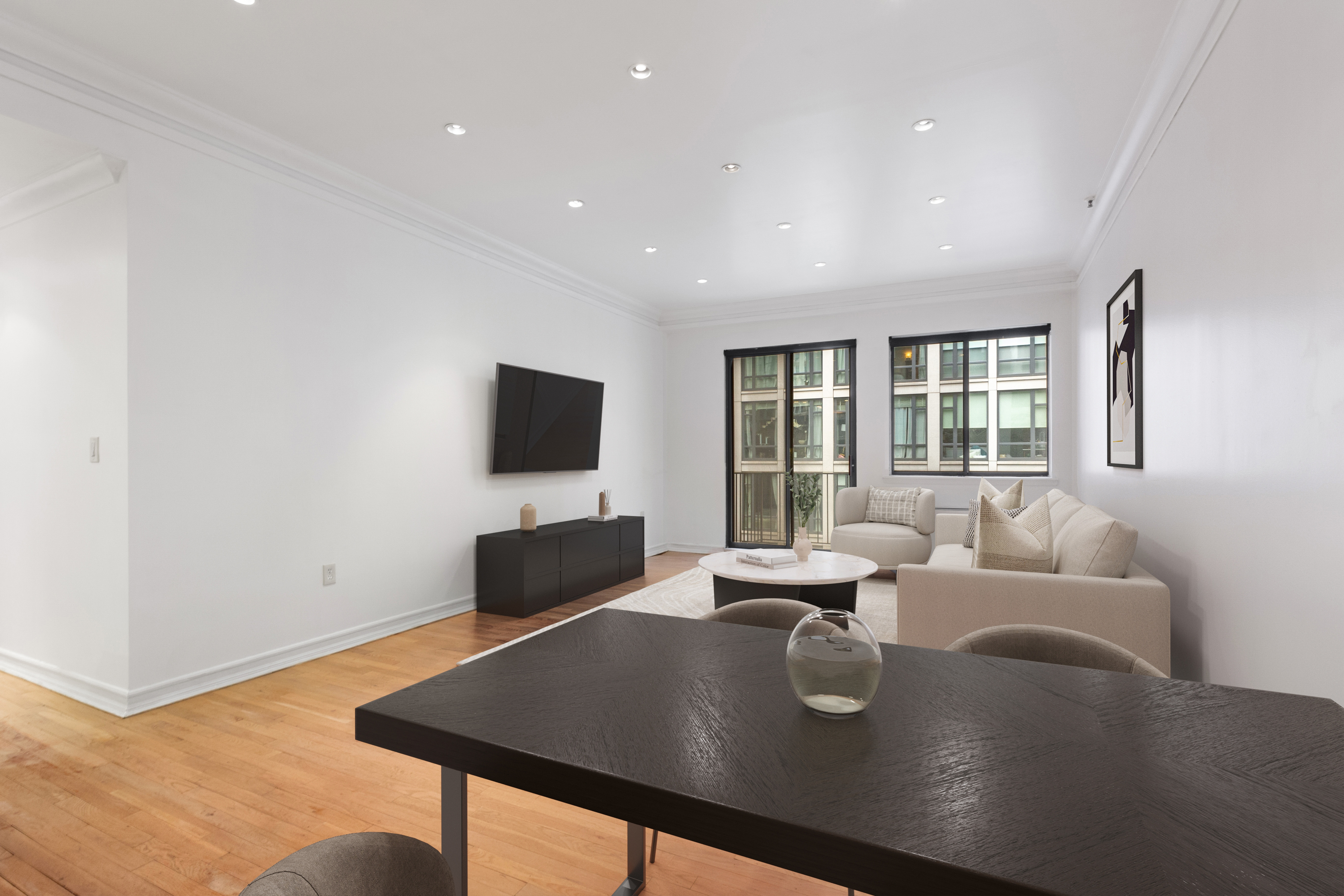 a living room with furniture and a flat screen tv
