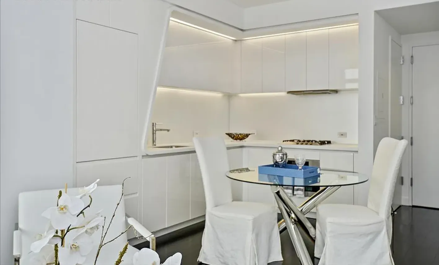 a kitchen with a table and a stove