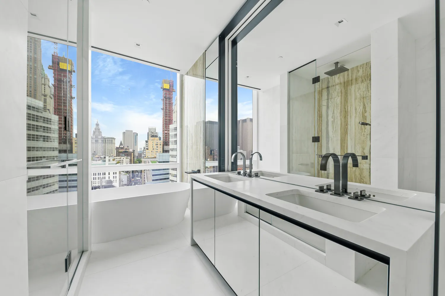 a bathroom with a white toilet sitting next to a bathroom sink and a shower