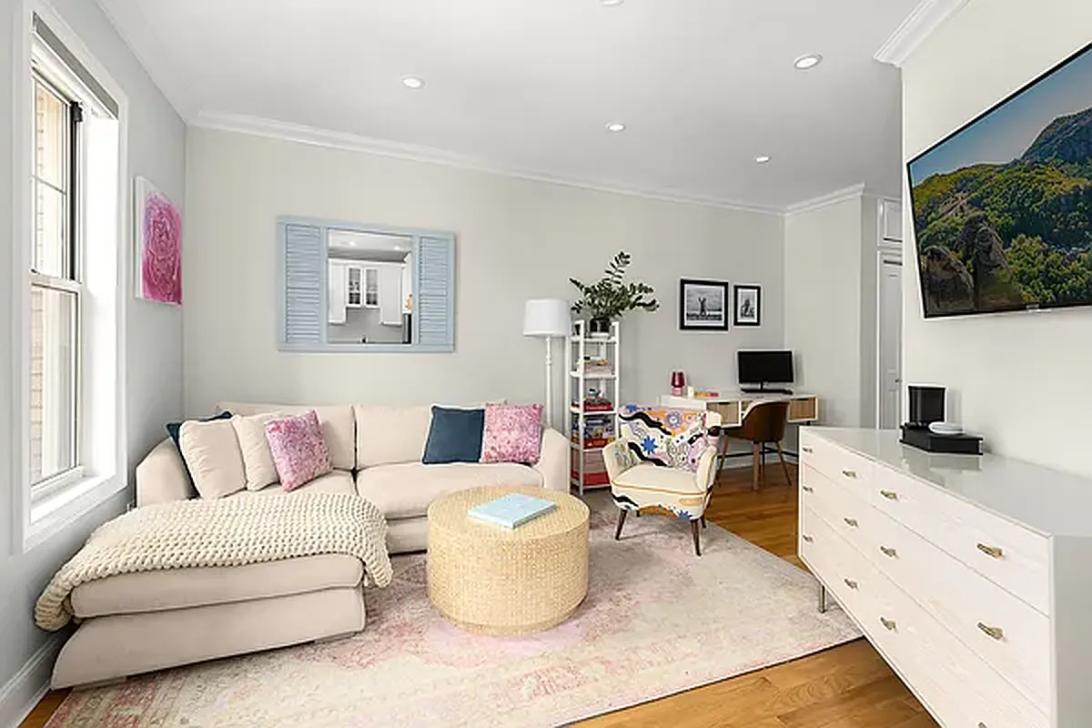 204 West 10th Street, Unit 18 Manhattan, NY 10014 - Photo 3 of 10 a living room with furniture and a flat screen tv