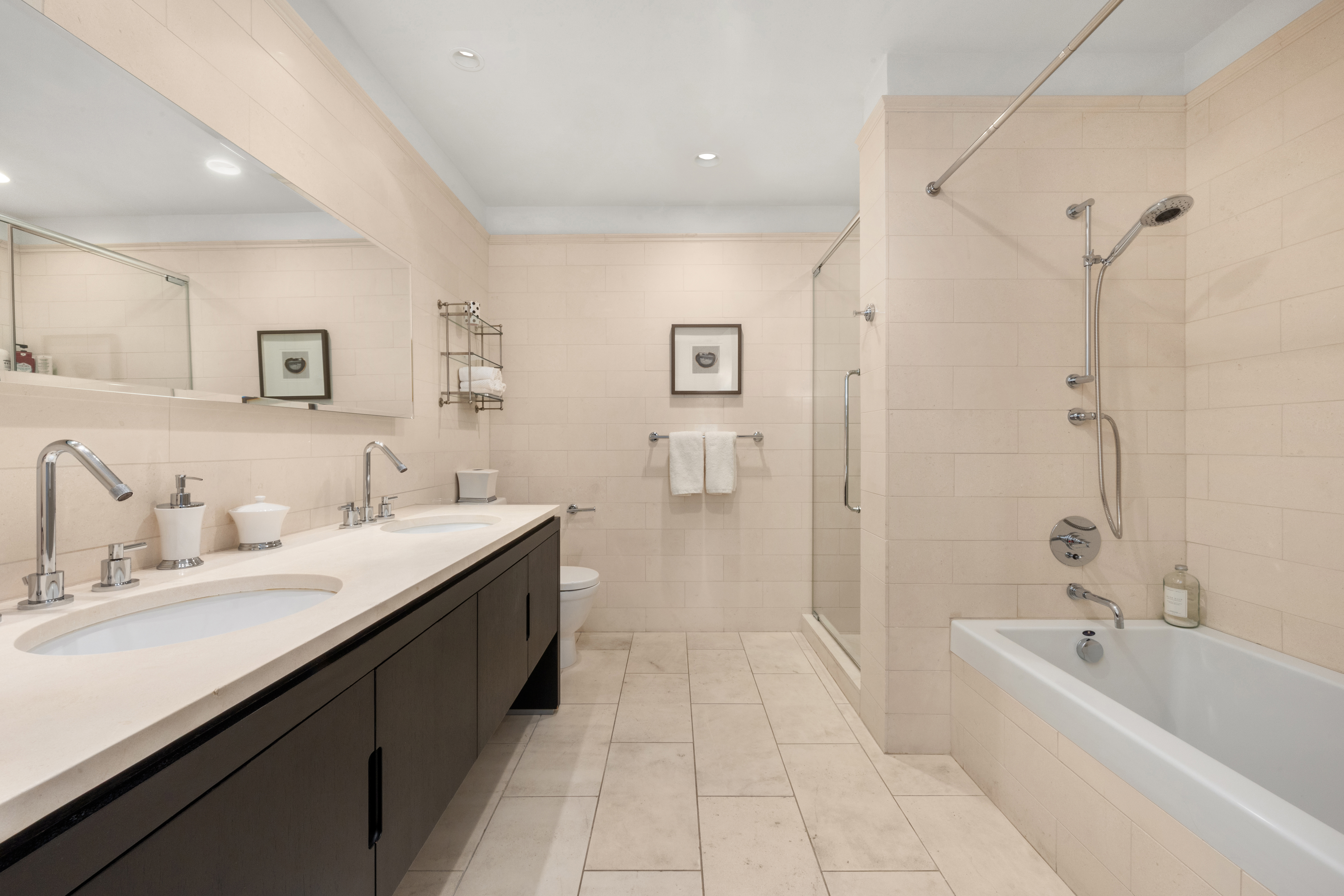 225 5th Avenue, Unit 11A Manhattan, NY 10010 - Photo 6 of 13 a spacious bathroom with a bathtub sink mirror and shower