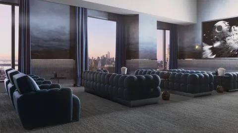 a living room with furniture and a lamp