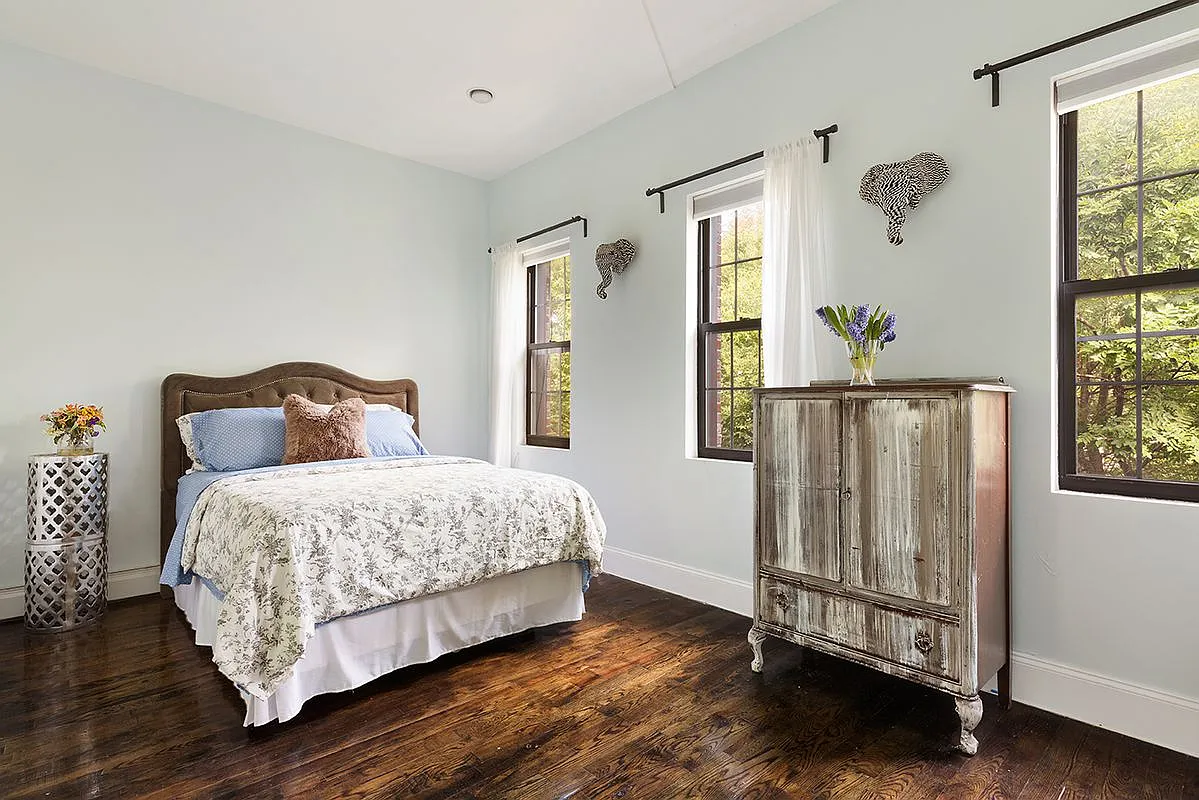 96 Sackman Street Brooklyn, NY 11233 - Photo 5 of 10 a bedroom with a bed and window