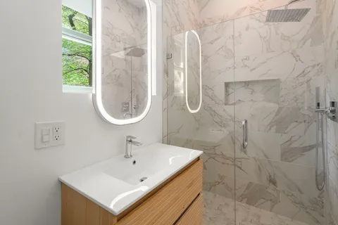 a bathroom with a sink and a mirror