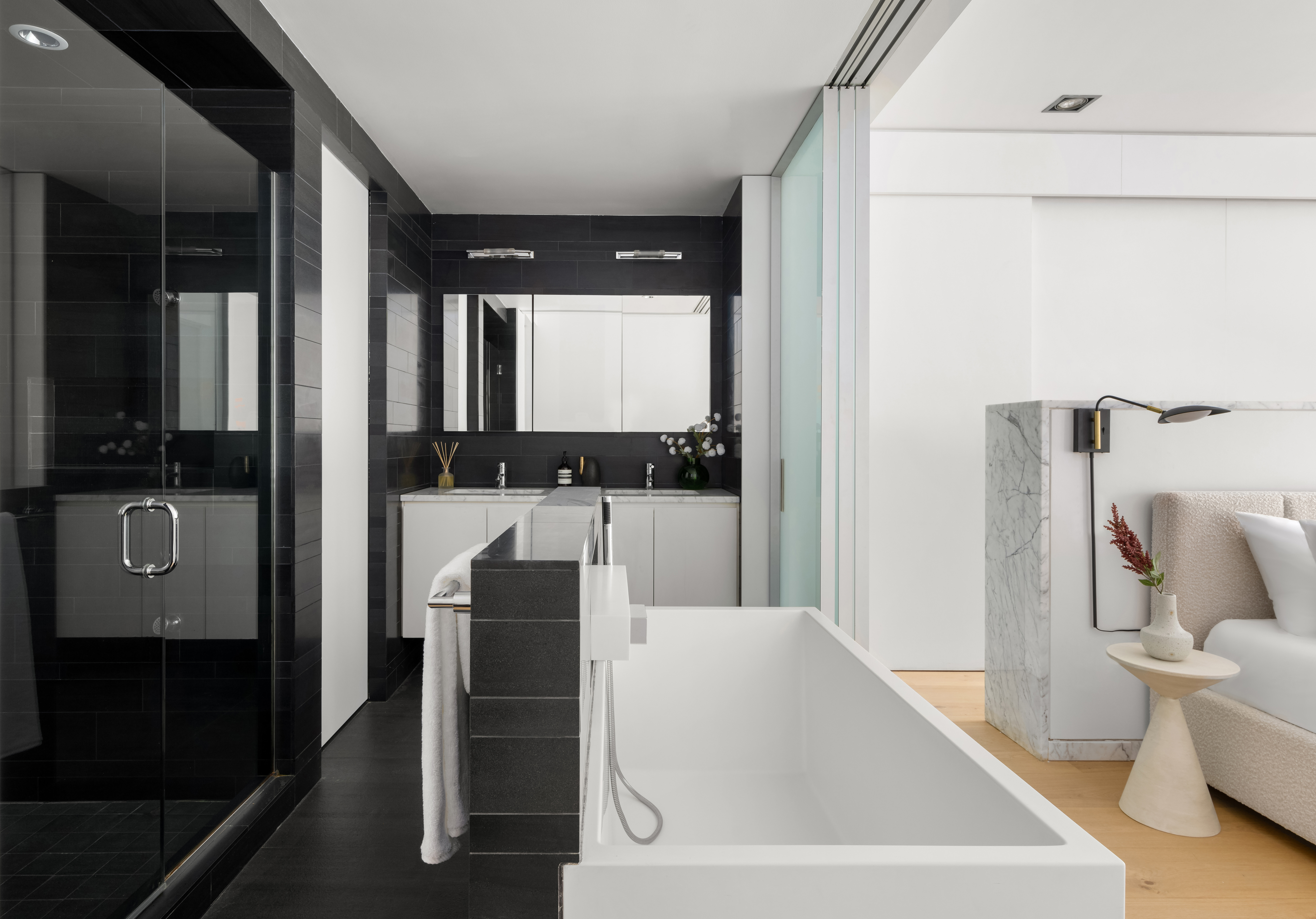 74 Warren Street, Unit 5W Manhattan, NY 10007 - Photo 11 of 15 a bathroom with a bathtub and a sink