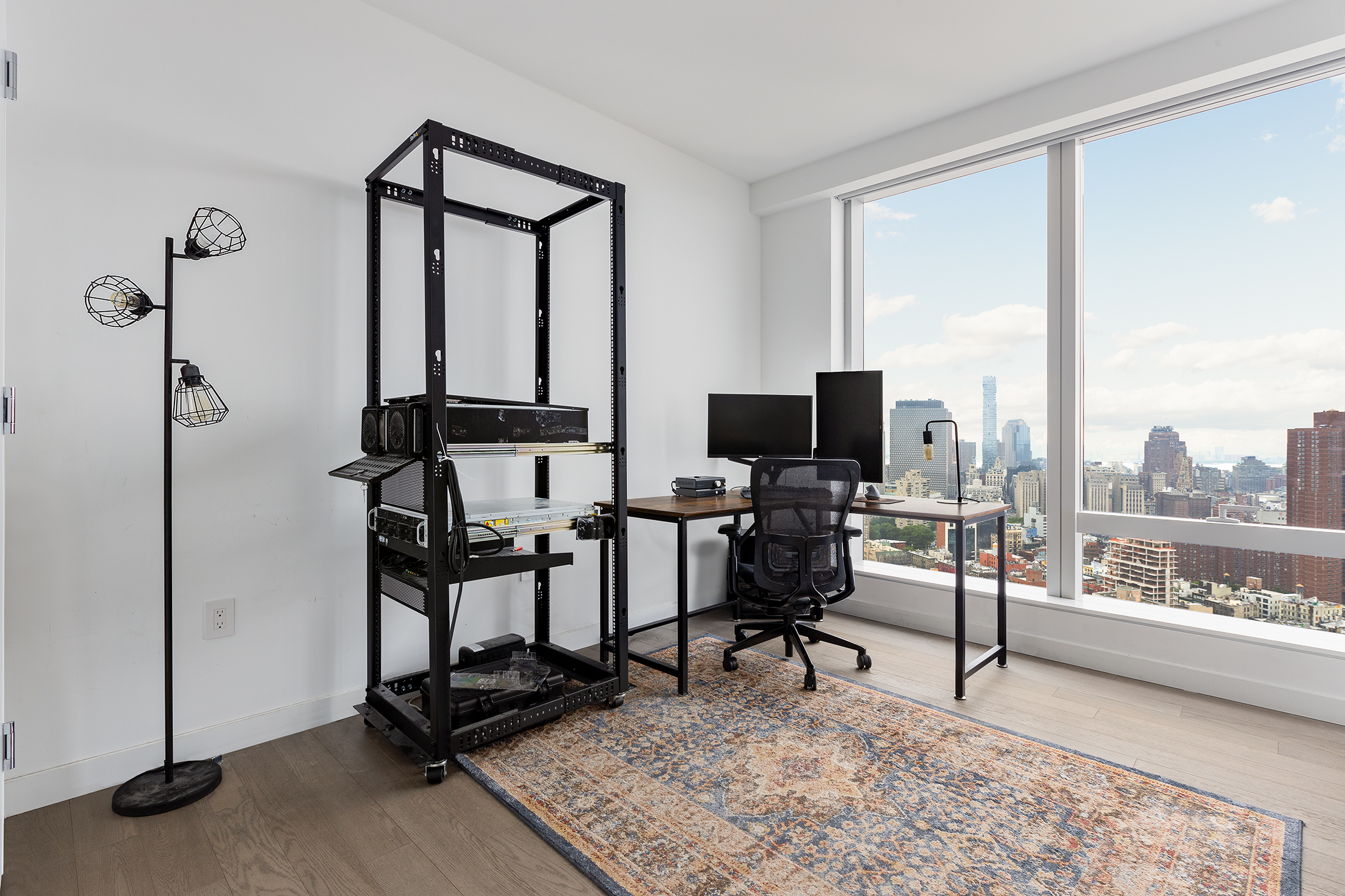 252 South Street, Unit 42K Manhattan, NY 10002 - Photo 5 of 6 a view of a livingroom with workspace and a window