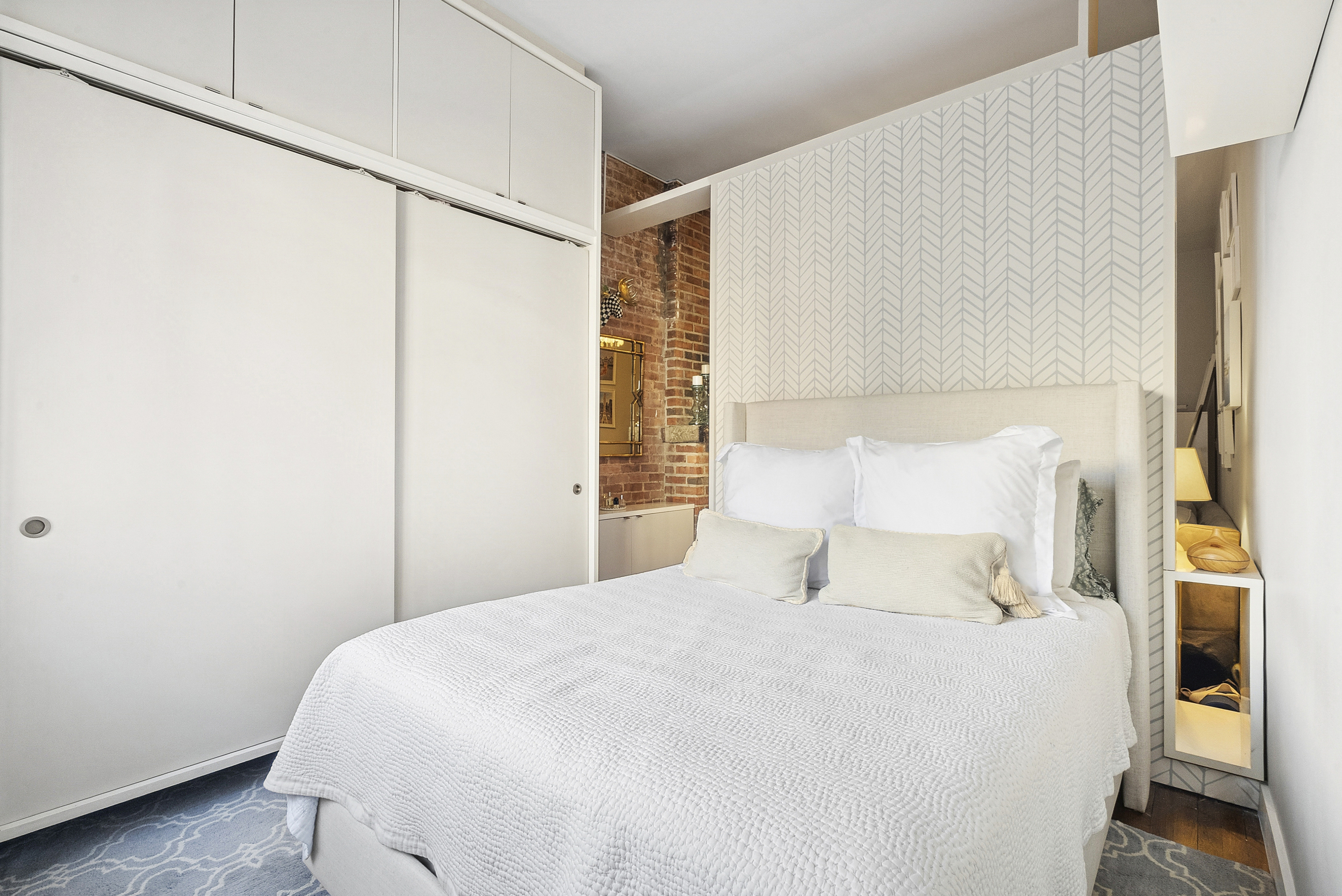 252 West 20th Street, Unit 2B Manhattan, NY 10011 - Photo 4 of 6 a bedroom with a bed and a window