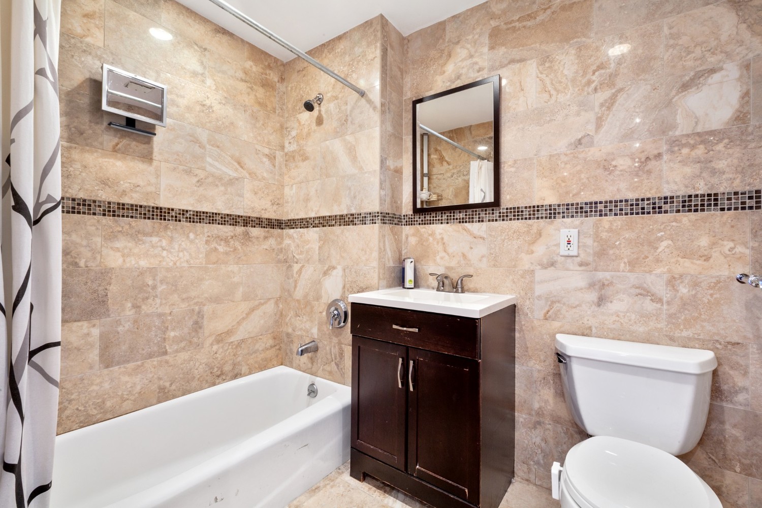 603 West 148th Street, Unit 10A Manhattan, NY 10031 - Photo 6 of 11 a bathroom with a sink a toilet and bathtub
