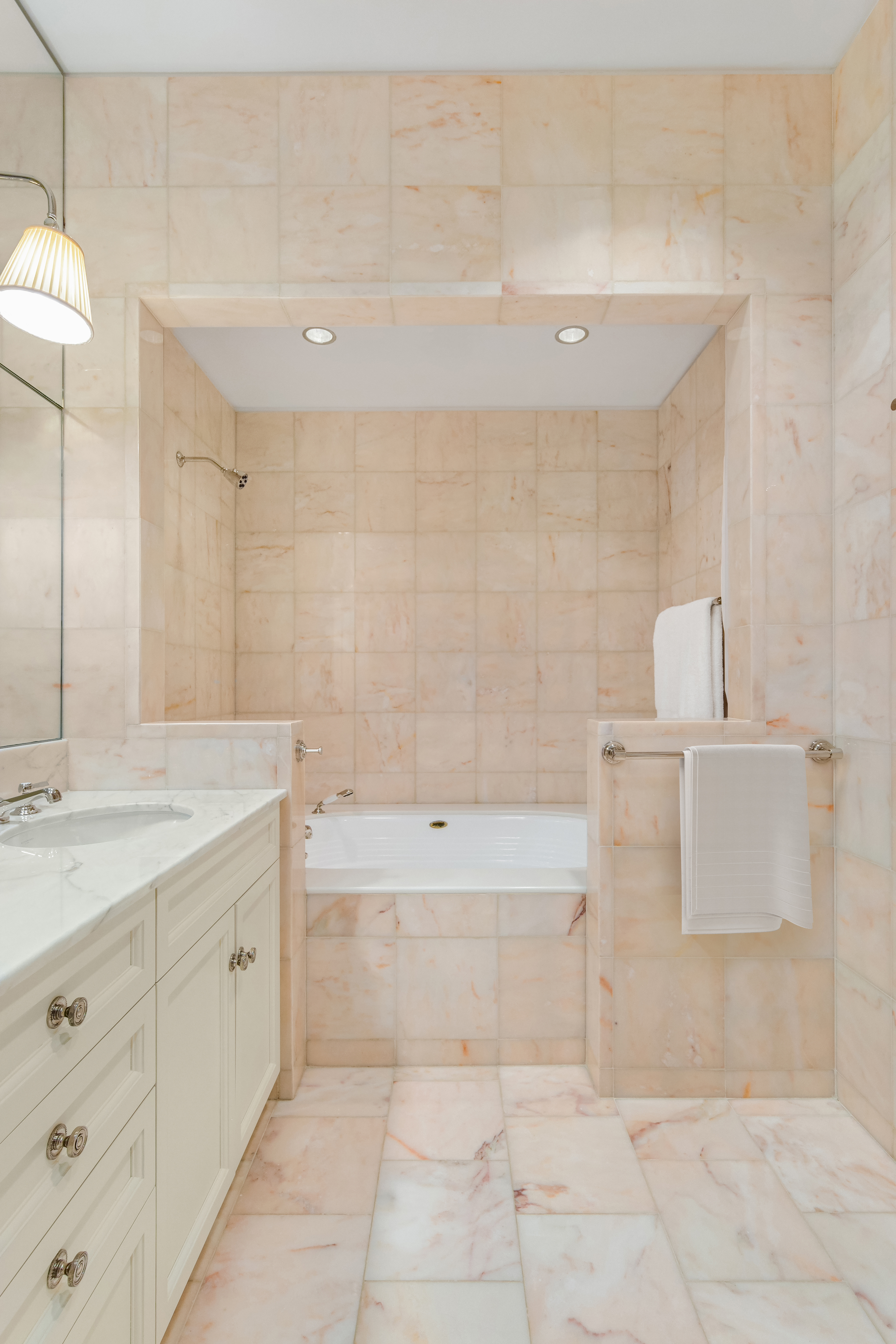 14 Sutton Place South, Unit PHA Manhattan, NY 10022 - Photo 11 of 22 a spacious bathroom with a bathtub sink and mirror