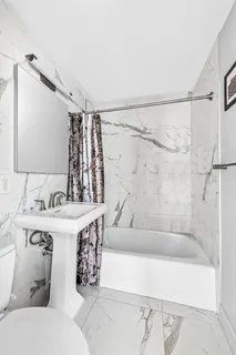 a bathroom with a bathtub and a sink