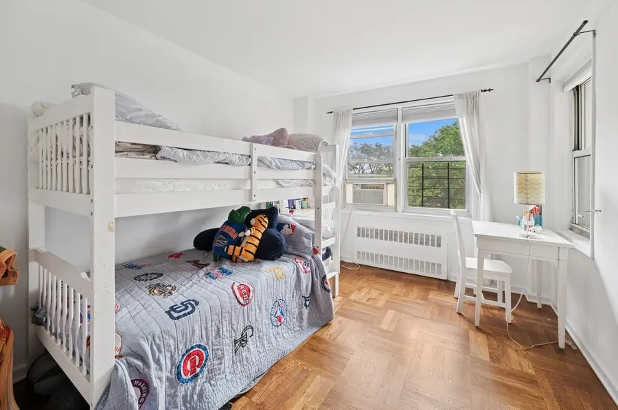 a bedroom with furniture and a window