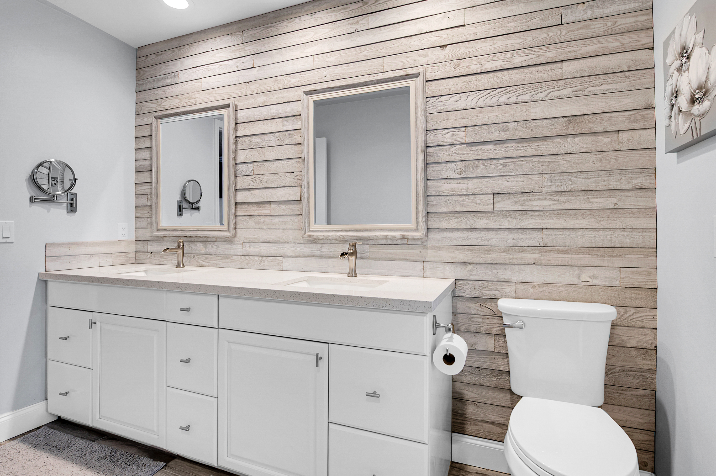 1560 Southwest 16th Street Boca Raton, FL 33486 - Photo 66 of 72 a bathroom with a toilet a sink a mirror and vanity