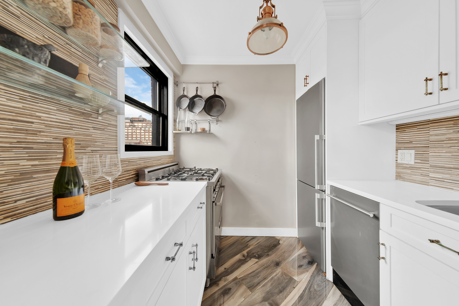 31 Jane Street, Unit 7A Manhattan, NY 10014 - Photo 4 of 11 a bathroom with a sink and a mirror