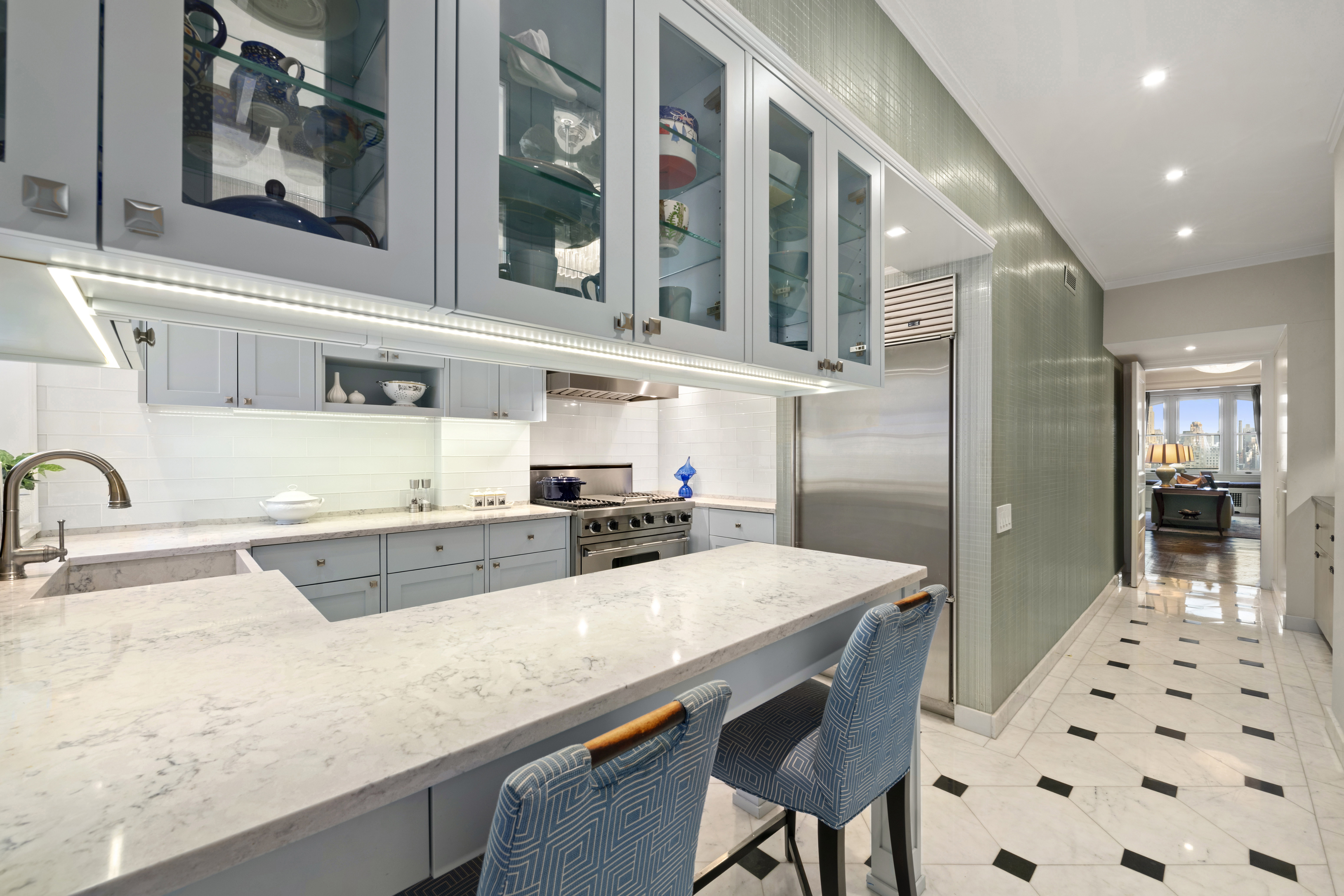 151 Central Park West, Unit 11NORTH Manhattan, NY 10023 - Photo 9 of 19 a kitchen with stainless steel appliances a sink and a refrigerator
