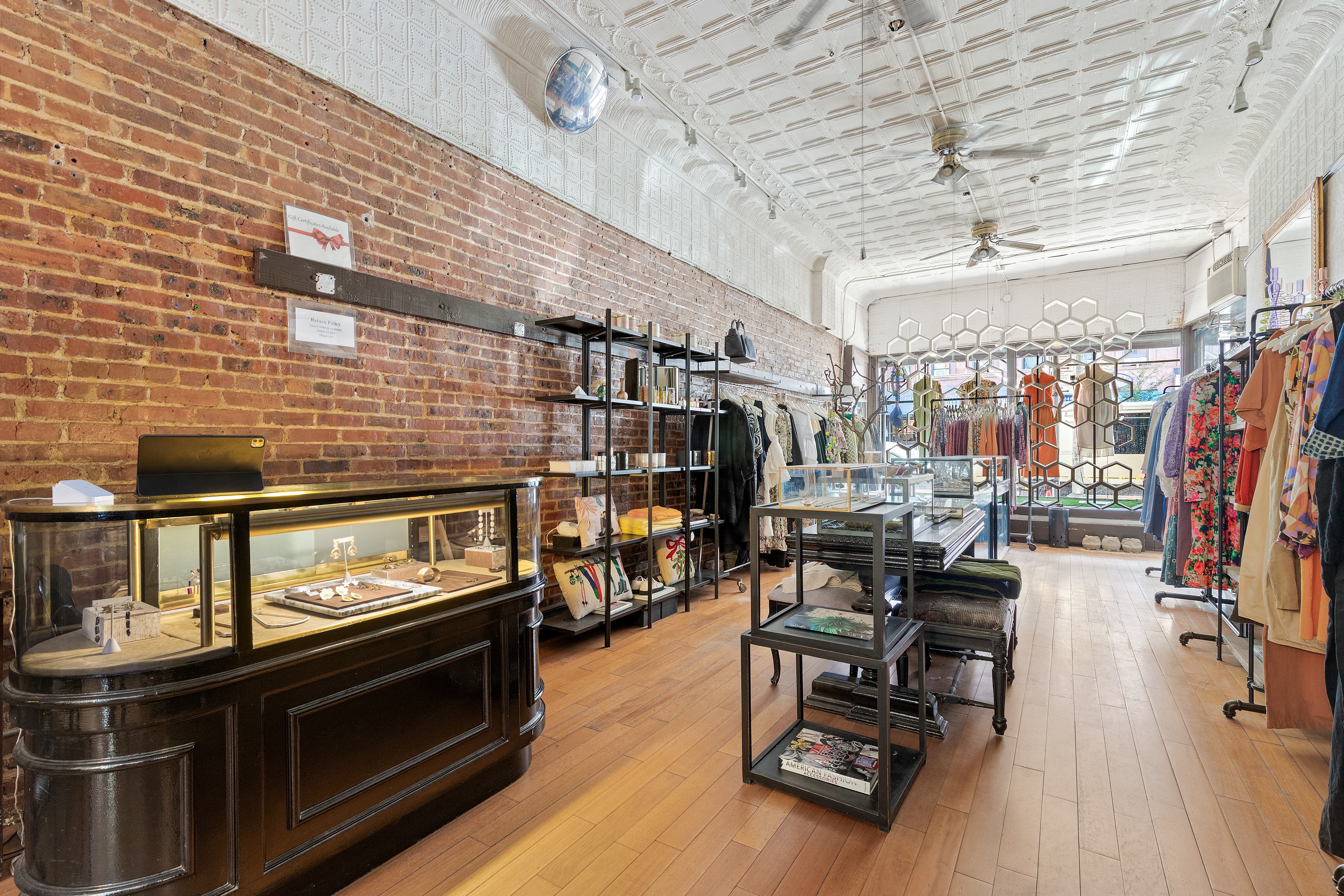 360 7th Avenue, Unit STORE Brooklyn, NY 11215 - Photo 3 of 8 a living room with lots of wooden furniture