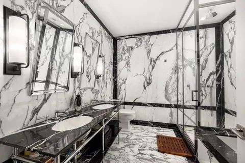 a view of empty room with wooden floor and windows