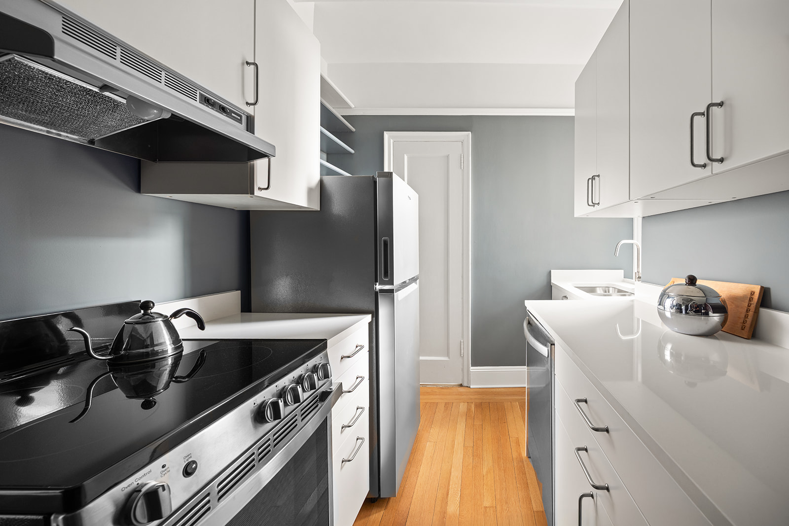 39 Plaza Street West, Unit 12B Brooklyn, NY 11217 - Photo 3 of 12 a kitchen with stainless steel appliances granite countertop a sink a stove and a refrigerator