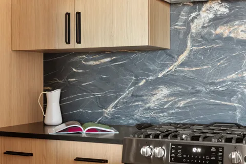 a kitchen with a sink cabinets and window
