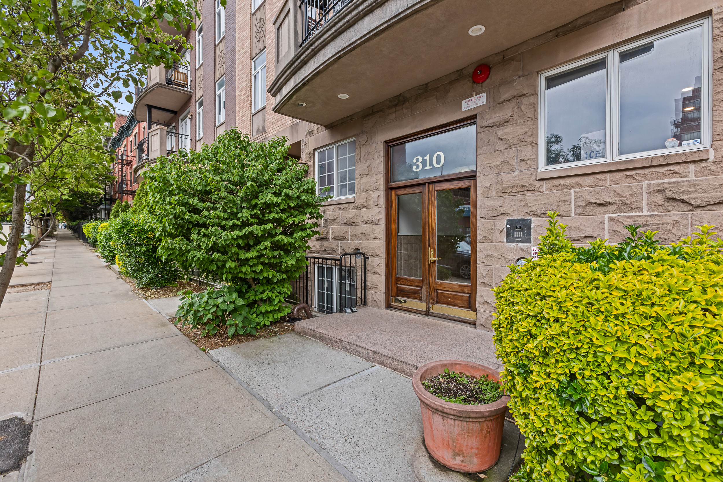 310 2nd Street, Unit 3C Brooklyn, NY 11215 - Photo 13 of 14 a front view of a house with plants