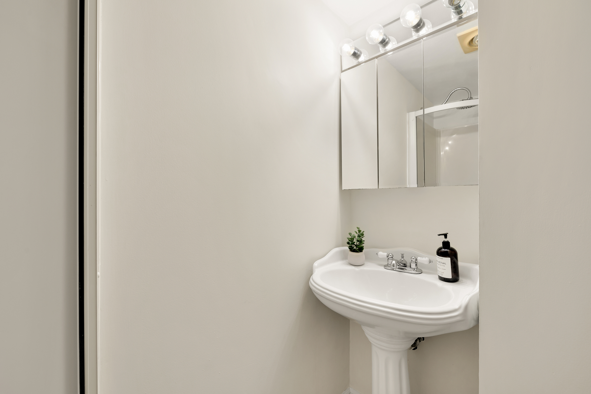 903 F Street Northeast Washington, DC 20002 - Photo 38 of 41 a bathroom with a sink and mirror