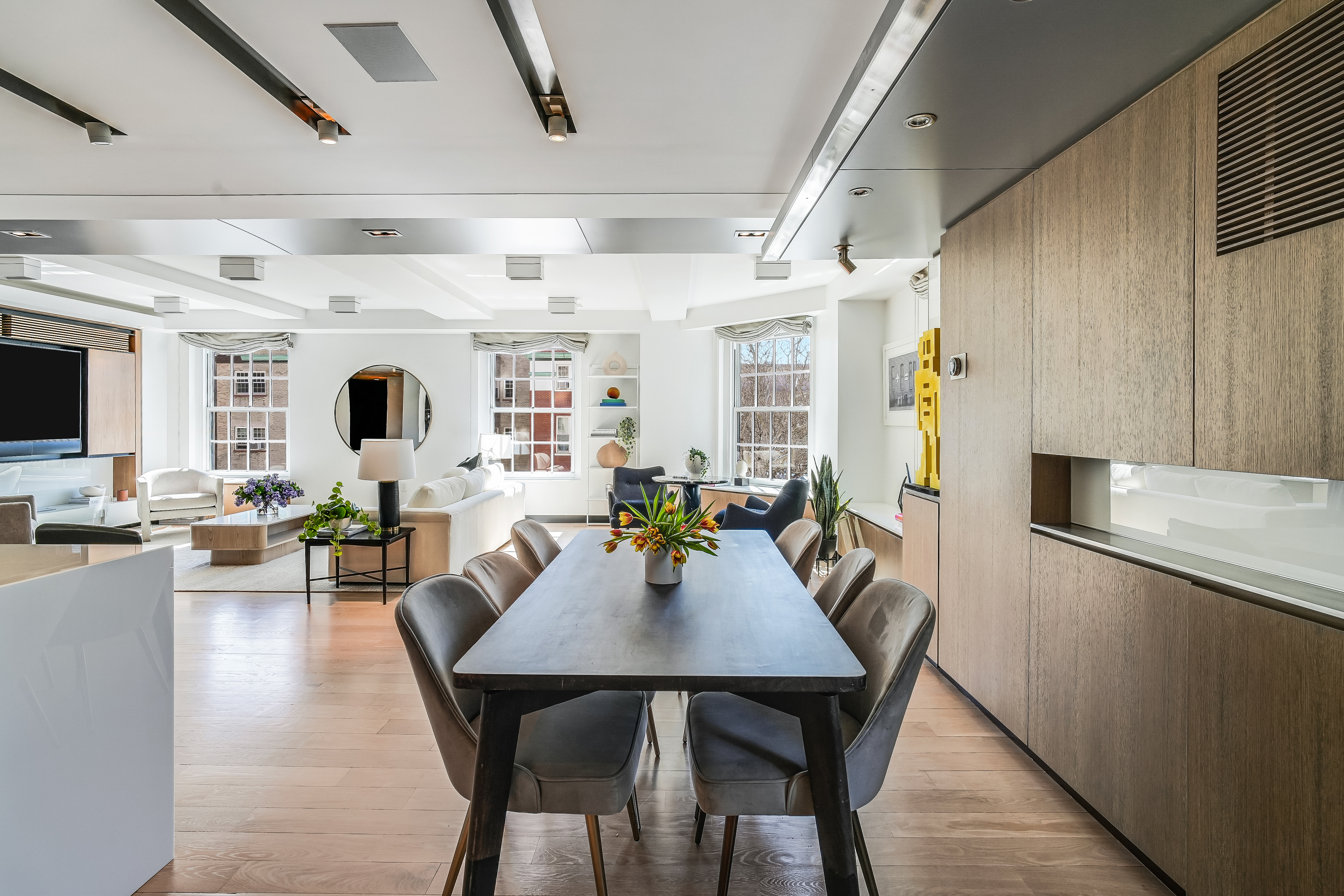 1 5th Avenue, Unit 5GH Manhattan, NY 10003 - Photo 8 of 26 a view of a dining room with furniture and a livingroom