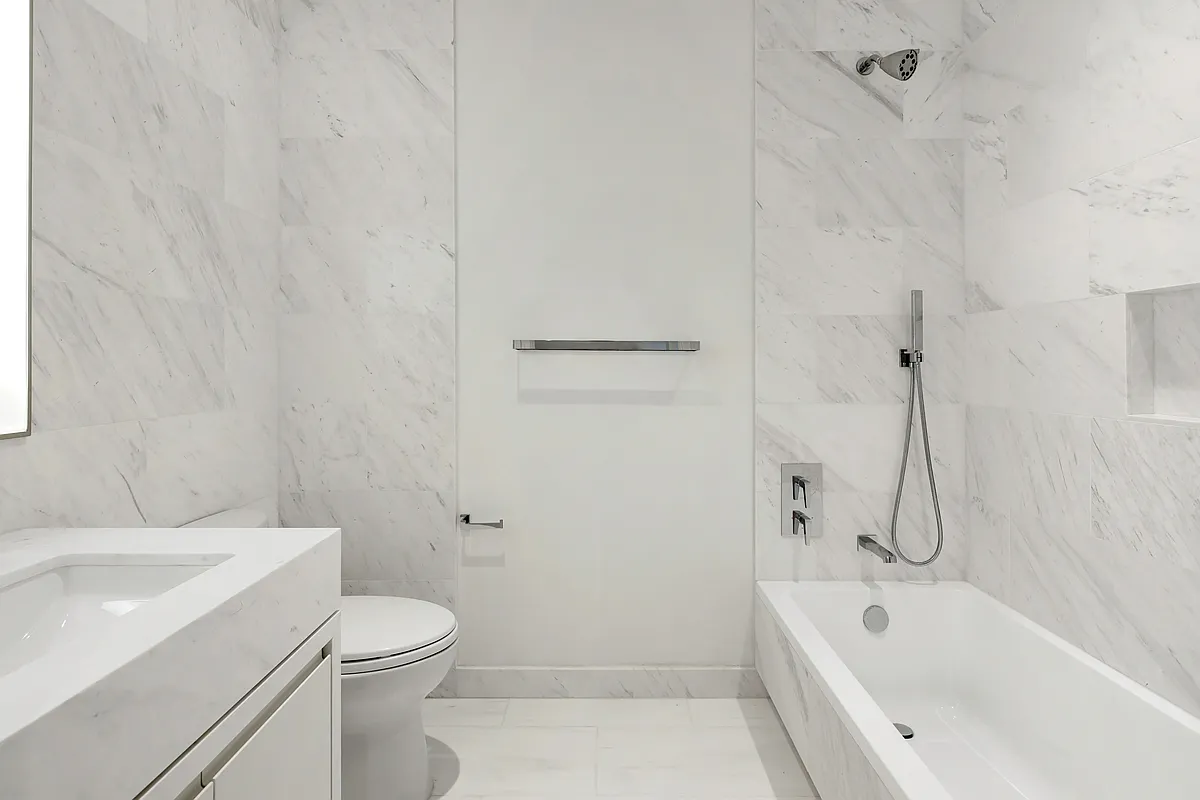 269 West 87th Street, Unit 14A Manhattan, NY 10024 - Photo 10 of 23 a bathroom with a white bath tub a toilet and a sink