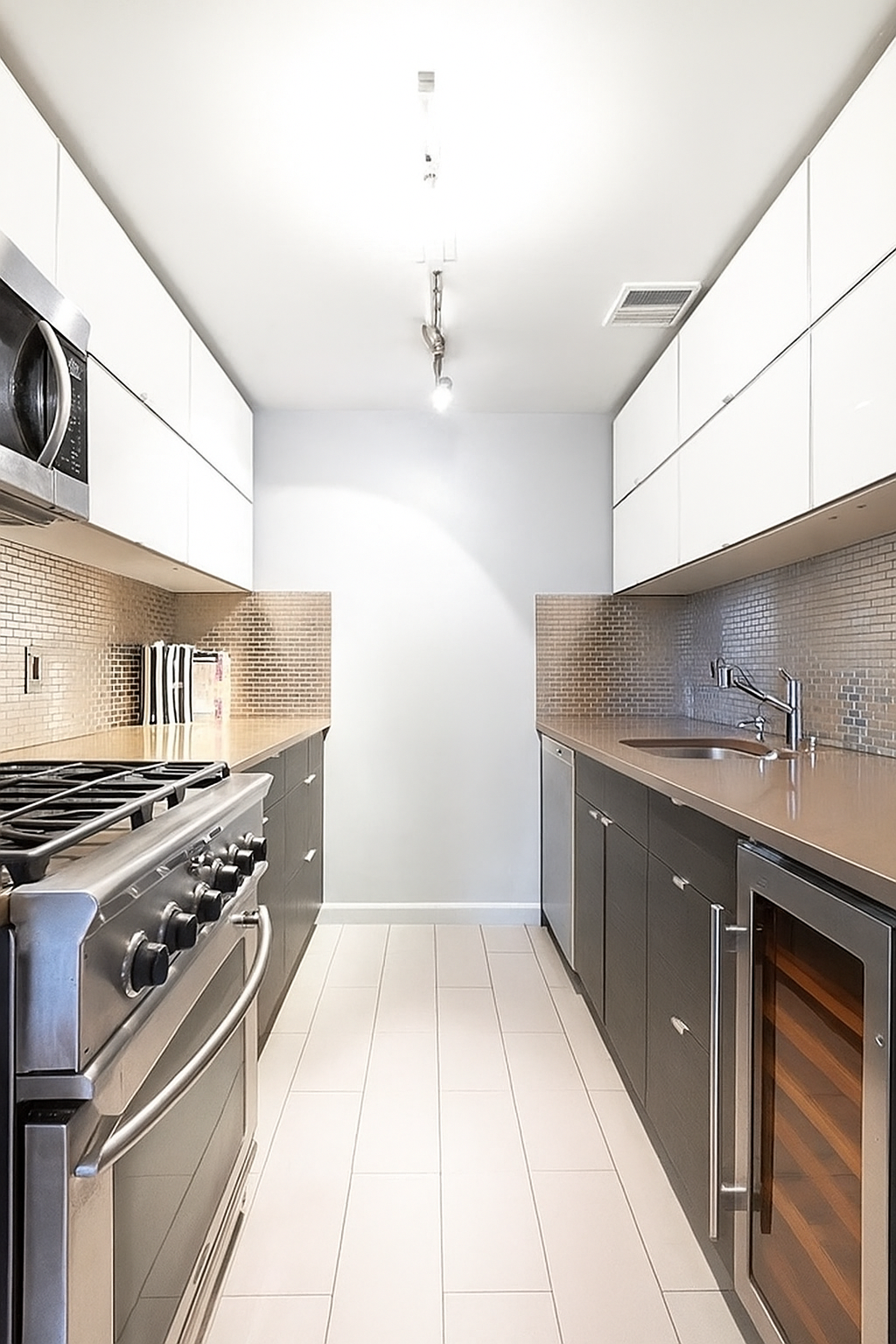 143 Avenue B, Unit 3C Manhattan, NY 10009 - Photo 3 of 7 a kitchen with a stove and a sink
