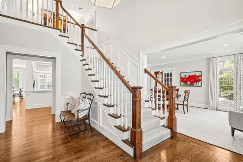 a view of entryway dining room and hall with wooden floor