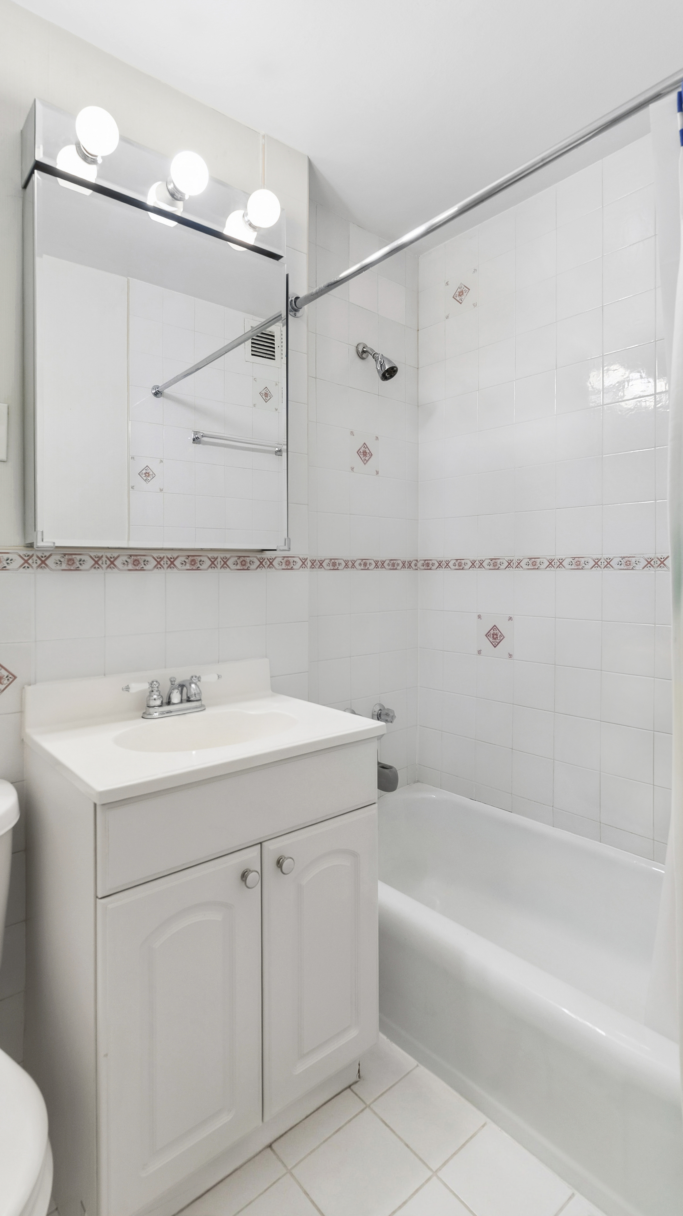 333 East 79th Street, Unit 8X Manhattan, NY 10075 - Photo 7 of 8 a bathroom with a sink and a mirror