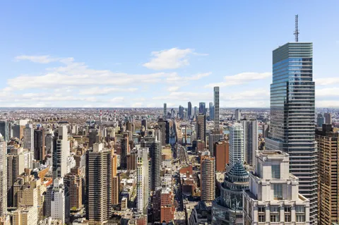 a view of city with tall buildings