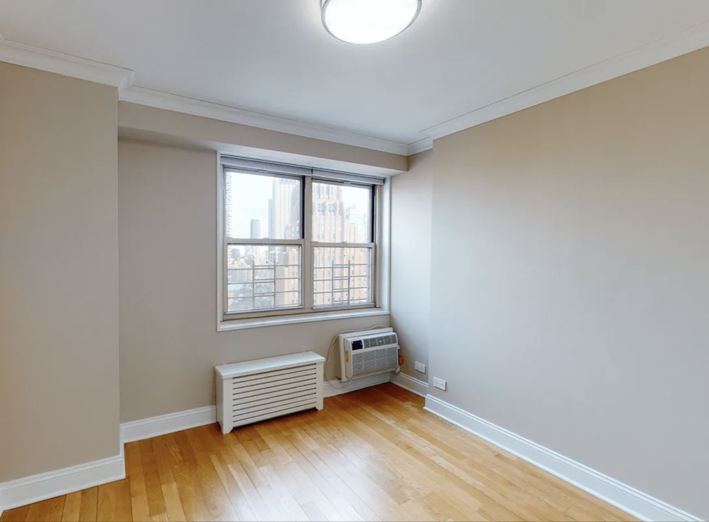 40 Harrison Street, Unit 24H Manhattan, NY 10013 - Photo 14 of 17 an empty room with a window
