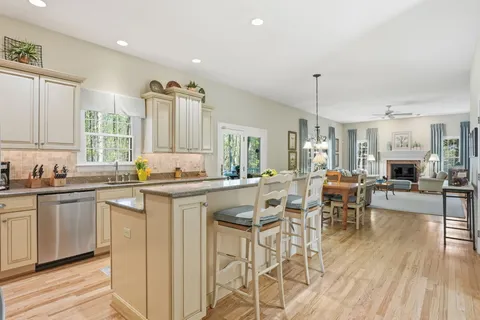 a view of a livingroom with furniture window and wooden floor