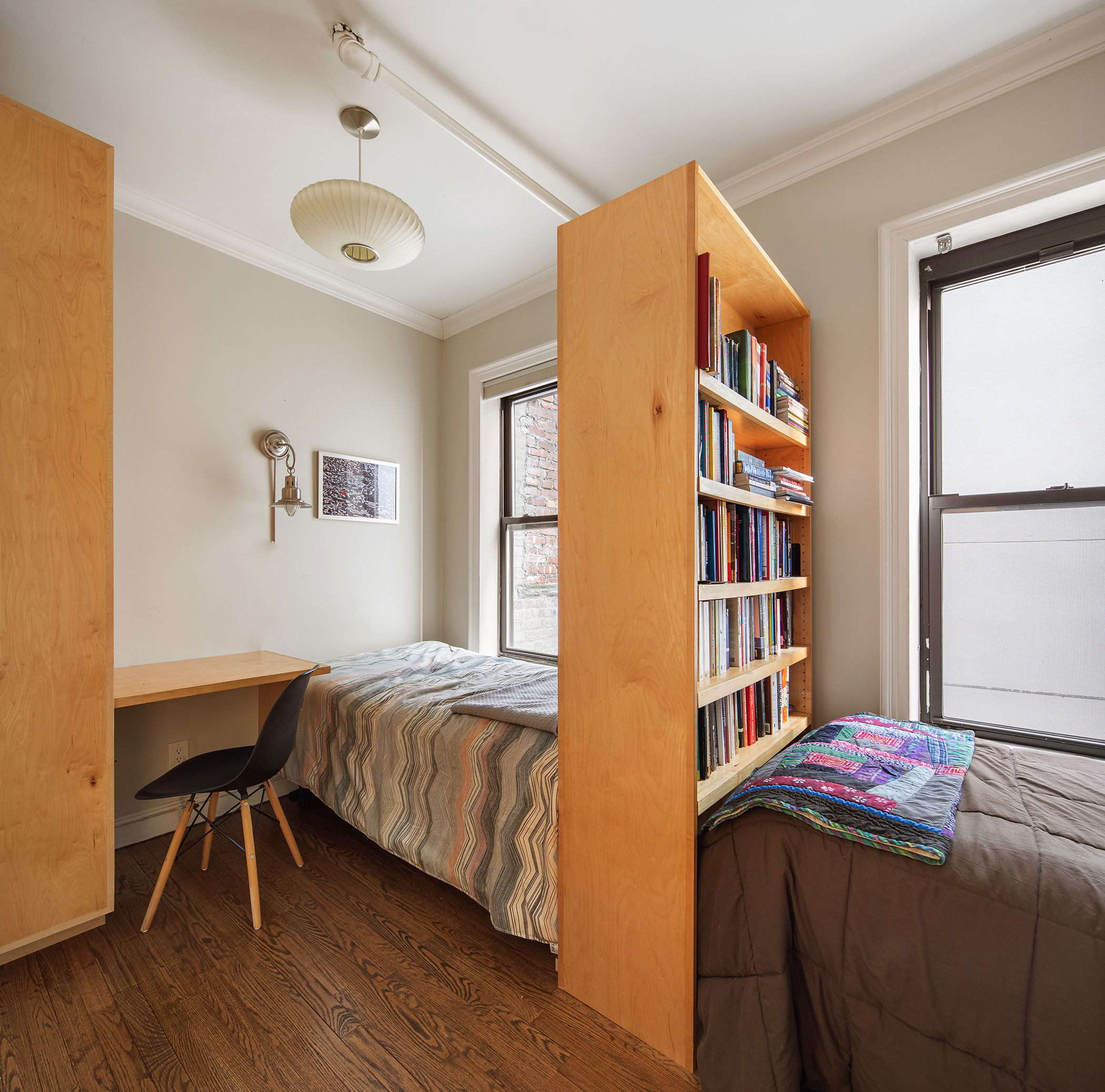 467 Pacific Street, Unit 10 Brooklyn, NY 11217 - Photo 6 of 10 a bedroom with a bed and a bookshelf