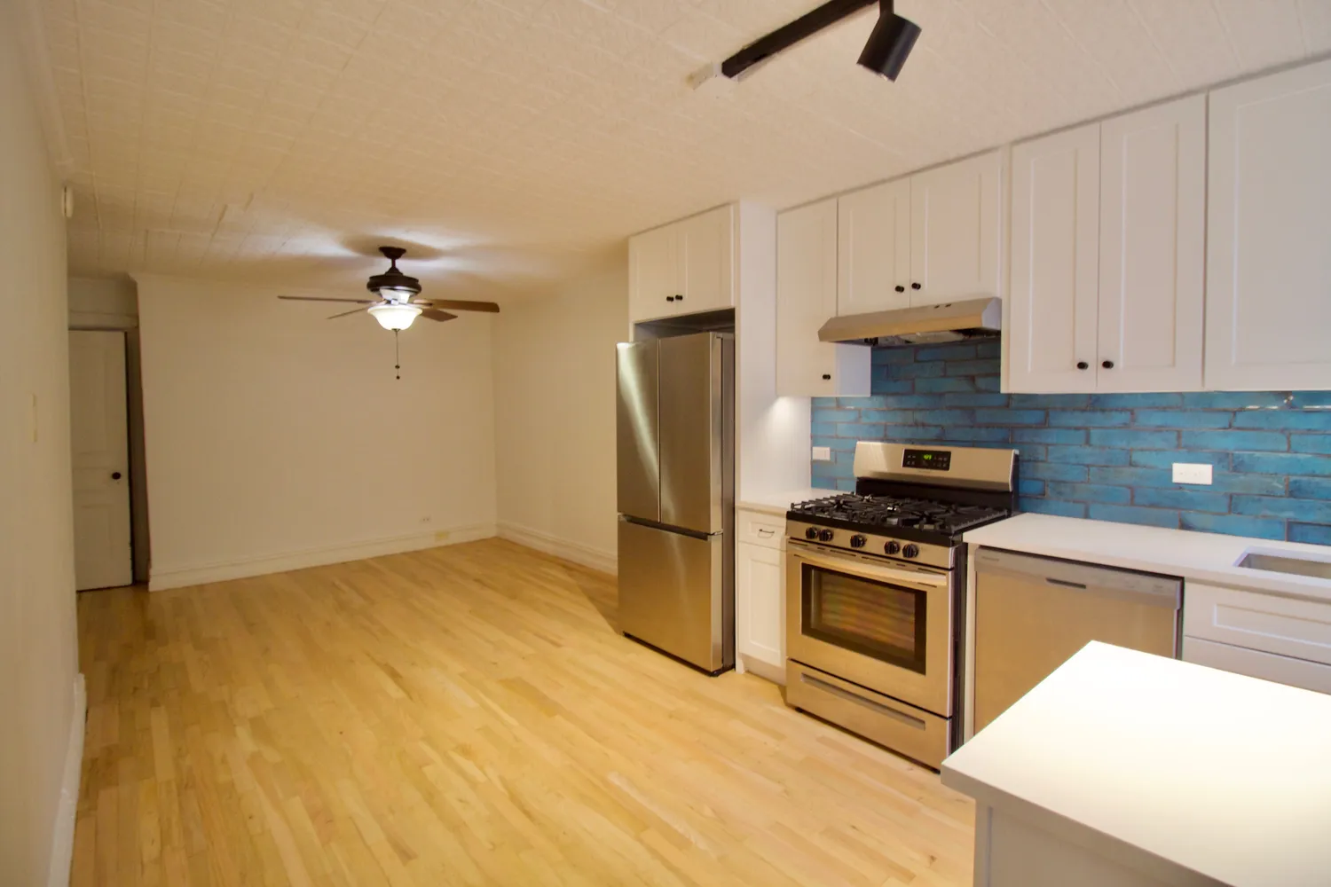 a view of livingroom with furniture ceiling fan and window