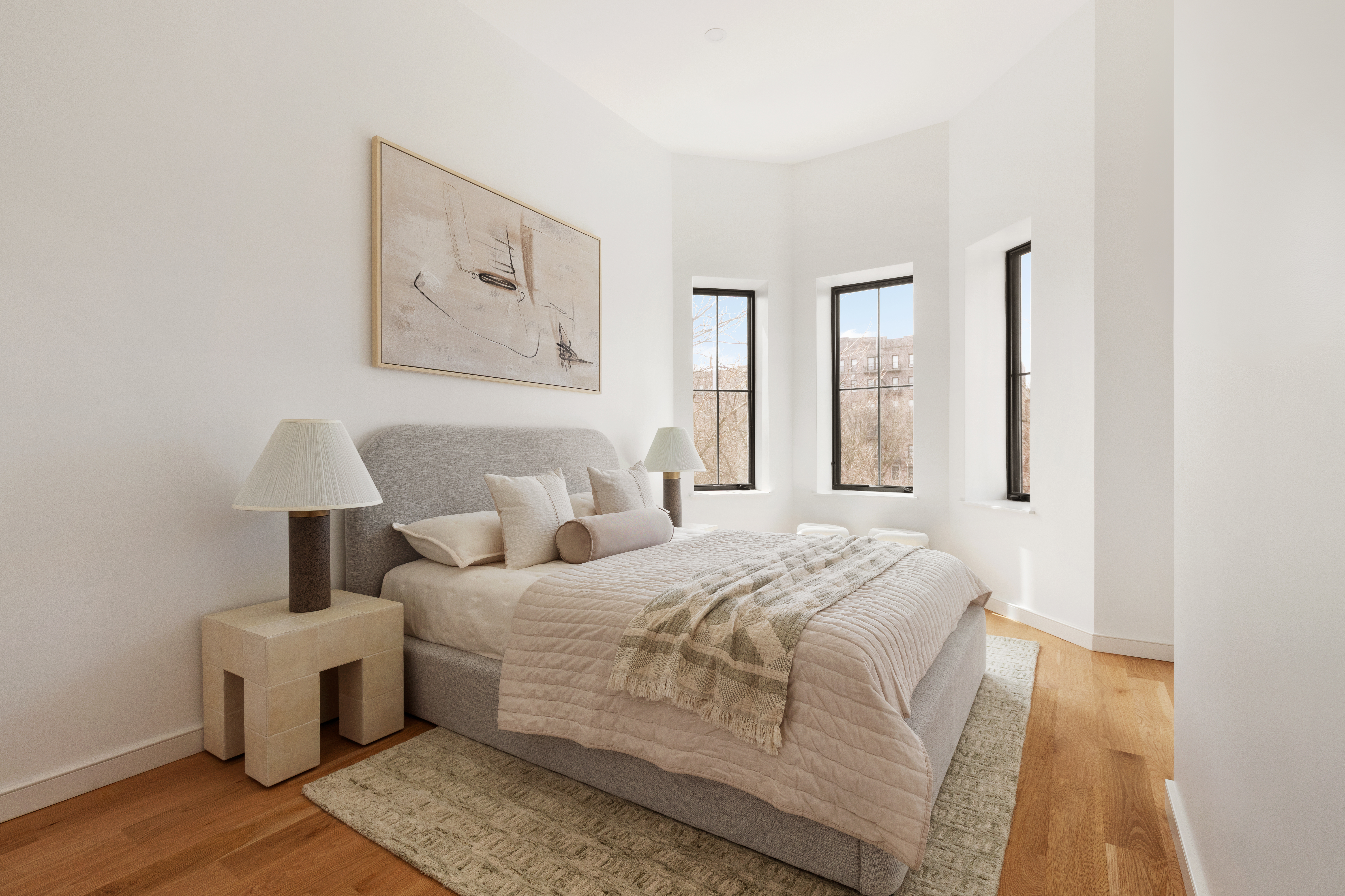 357 Eastern Parkway Brooklyn, NY 11216 - Photo 10 of 15 a bedroom with a large bed and a window